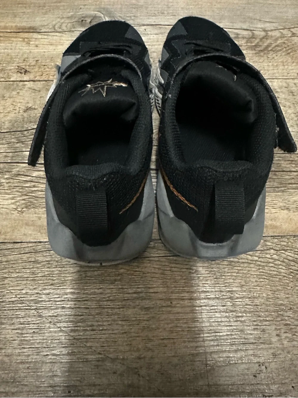 Nike Kids Black and Gold Low-Top Sneakers